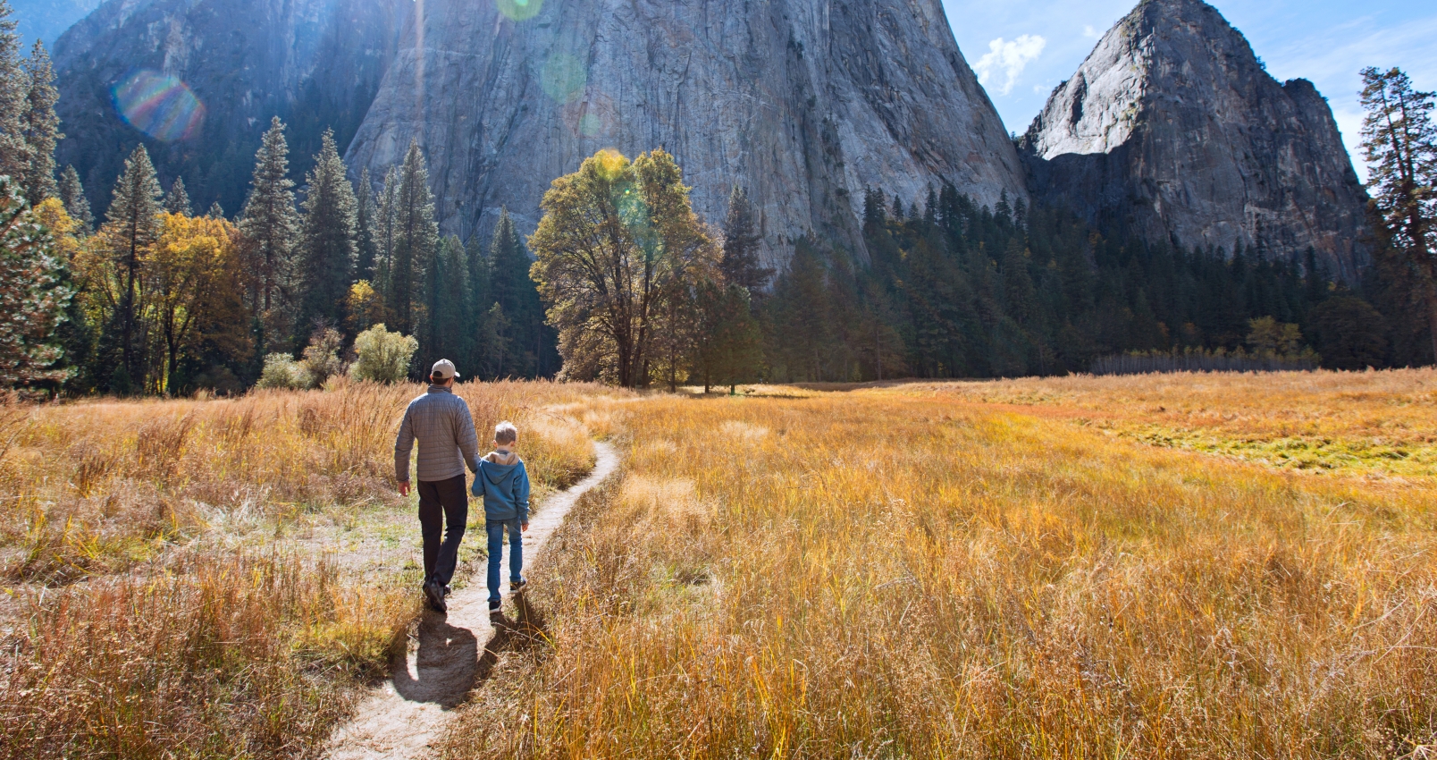 father and son walking el Capitan at Yosemite National Park